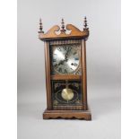 An early 20th century mahogany cased 31-day drop dial clock with silvered dial and Roman numerals,