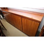 A 1960s Skovby rosewood sideboard, fitted drawers and shelves, enclosed four doors, on block base,