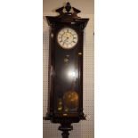 A Vienna type wall clock, in polished as walnut case, 48" high