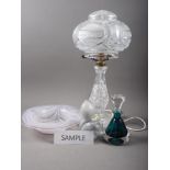 An Adrian Sankey art glass bowl, 9 3/4" dia, four similar bowls, a green glass scent bottle, a