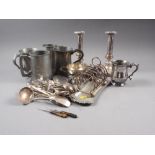 A pair of Sheffield plated candlesticks, a silver plated tankard, a plated toast rack, plated