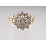 An 18ct gold and diamond cluster ring, size M, 4.9g