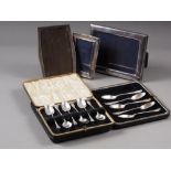 A set of six silver teaspoons, in box, a similar set of five teaspoons, 3.4oz troy approx, and three