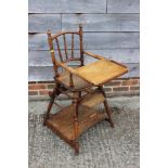 A child's Edwardian metamorphic high chair/table, a mahogany bed table, 22" wide, and a three-tier