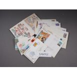 A quantity of ephemera, including a cigarette card album, two stamp albums, first day covers and a