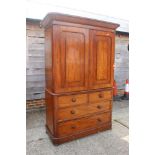 A late Victorian figured mahogany linen press, the upper section fitted trays and shelves,
