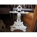 A white painted cast iron scrollwork stick stand, 30" high