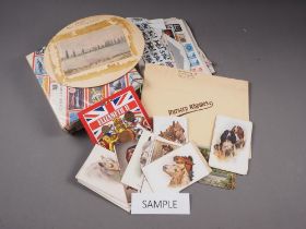 Four albums of postcards, mostly topographical, a number of loose postcards, two stamp albums and