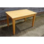 A maple top table, on square tapered supports, 37" wide x 30" deep x 29" high