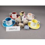 A Susie Cooper part coffee set, three Royal Doulton ceramic flower displays, three others and