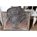 A cast iron fire back with royal coat of arms and dated 1633, 24" wide x 20" high