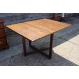 A 1960s Canadian maple dining suite, comprising dropleaf table, 46" wide x 38" deep x 29" high,