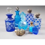 A Victorian white metal mounted blue overlaid cut glass scent bottle, 4 1/4" high, another similar