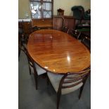 A 1960s Skovby rosewood extending dining table with two extra leaves, on double pedestal support,