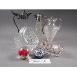 Two clear glass and pewter mounted claret jugs, two oval dishes with gilt highlights, a glass