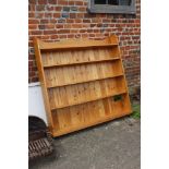 A pine bookcase with three shelves, 48" wide x 6 1/2" deep x 41" high, an open bookcase, fitted