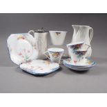 An Art Deco bone china floral decorated part tea service for three, and two 19th century relief