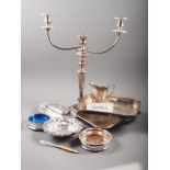 A silver plated two-branch three-light candelabra, 20" high, a two-handled tray with engraved leaf