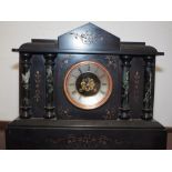 A late 19th century black marble mantel clock with eight-day striking movement, 16" high
