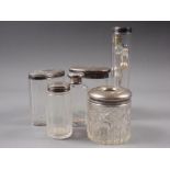 Five silver topped dressing table bottles and a white metal topped scent bottle, 3.1oz troy approx