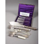 A quantity of loose silver plated cutlery, empty cutlery boxes, fish servers and other items