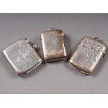 Two silver vesta cases with engraved decoration, and another similar vesta case, 2oz troy approx