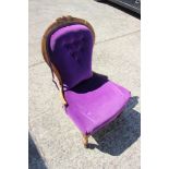 A late 19th century polished as walnut showframe low seat nursing chair, on cabriole supports