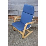 A child's bentwood cantilever elbow chair and a child's rattan low seat armchair