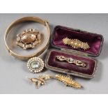 A Victorian 15ct gold brooch, another similar yellow metal brooch set, seed pearls formed as a