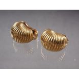 A pair of French 18ct gold clips with ribbed decoration, 21.4g approximately 2cm long x 1.5cm wide