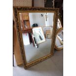 A bevel edge wall mirror, in gilt frame, 29" x 42" overall