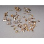A collection of 9ct gold and yellow metal earrings, ear studs, etc., total weight 39.9g