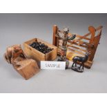 A carved burr elm model of a toad, a wooden pipe rack, a miniature pole, a chess set and other