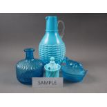 A milk blue glass jug with cane work effect decoration, 11 3/4" high, a similar vase, a butter