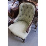 A Victorian carved walnut showframe tub seat armchair, upholstered in a green figured brocade, on