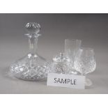 Nine cut glass brandy balloons, four decanters, a condiment pot and cover, and a high ball glass (