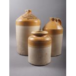 A Walter Sotham Wine & Spirit Merchant, Carfax stoneware flagon, 12 1/2" high, another similar and a