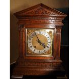 An Edwardian oak cased architectural mantel clock with brass dial and eight-day quarter striking