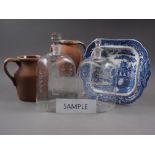 Two clear glass Dutch decanters with matched stoppers, five terracotta jugs and other items