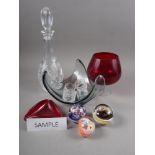 Three Selkirk glass paperweights, two decanters, a selection of Poole pottery, including a teapot,