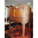 A 19th century mahogany tray top bowfront washstand, enclosed two doors over one drawer, on