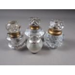 Three cut glass inkwells and a silver mounted vesta striker