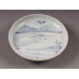 A Chinese blue and white saucer dish, decorated riverscape, from the Vung Tau cargo, 4 3/4" high (