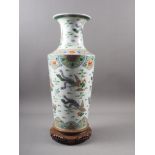 A Chinese famille vert vase with flared rim and tapering body, decorated phoenix and clouds, on