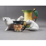 Four Lladro polar bear figures, a Burleigh ware jug with parrot handle and a Royal Doulton Tony