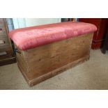 A waxed pine blanket box/ottoman with padded top, 38" wide x 18" deep x 20" high