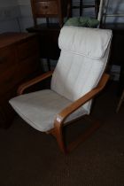 A beech framed cantilever armchair, upholstered in an off-white linen fabric