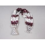 A white metal, stamped 925, rock crystal and garnet bead bracelet