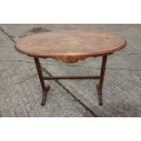 A burr walnut oval top occasional table, on splay supports, 40" wide x 20" deep x 31" high