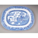 A blue and white willow pattern meat plate, 18" wide
